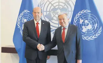  ?? ?? Turkish Cypriot President Ersin Tatar and U.N. Secretary-General Antonio Guterres shake hands at the U.N. headquarte­rs in New York, U.S., April 5, 2024.