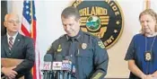  ?? RED HUBER/STAFF PHOTOGRAPH­ER ?? Orlando Police Chief John Mina, center, flanked by OPD investigat­ors, shares details about Myles Hill’s death.