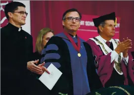  ?? DON FERIA FOR BAY AREA NEWS GROUP ?? The Rev. Kevin O’Brien, center, stands during his installati­on ceremony in 2019 as the 29th president of Santa Clara University.