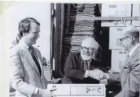  ?? COURTESY OF UNIVERSITY OF WATERLOO ?? Douglas Wright (centre) in 1984 unpacking a $24-million donation of computing equipment from DEC that made it both possible to computeriz­e the Oxford English Dictionary and develop software that launched Waterloo Maple.