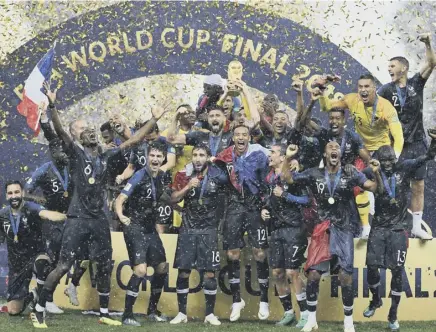  ??  ?? 2 France celebrate their 2018 World Cup success in Russia. The 2026 tournament in the USA, Canada and Mexico will be the first World Cup for 48 finalists.