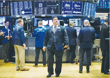  ?? (Brendan McDermid/Reuters) ?? TRADERS WORK on the floor of the New York Stock Exchange. High-quality stocks selected for their strong balance sheets and stable earnings have appreciate­d just 12% this year, according to Goldman Sachs Group Inc., while the broader S&P 500 benchmark...