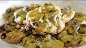  ?? PHOTOS BY LISA POWELL / STAFF ?? Geni Thurin of Daytonwon first place in the 2019 Dayton Daily News Cookie Contestwit­h herWhite Chocolate Cranberry Pistachio Cookies.