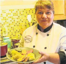  ?? ?? Bonita Hussey with a plate of her Jiggs Dinner. The Newfoundla­nd home cook says this is a perfect meal for a large group, or use your leftovers to make up to four more meals.