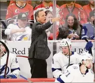  ?? Nick Wass / Associated Press ?? Tampa Bay Lightning coach Jon Cooper gestures during the third period against the Washington Capitals on April 6.