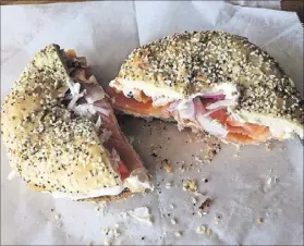  ?? LIGAYA FIGUERAS / LFIGUERAS@AJC.COM ?? A flagel (a flat bagel) with sliced Nova and cream cheese from Broadway Cafe.