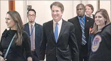  ?? Saul Loeb AFP/Getty Images ?? BRETT KAVANAUGH arrives for a meeting on Capitol Hill. Some legal experts say his work on the Starr Report could inf luence a future congressio­nal debate if President Trump faces impeachmen­t.