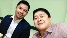  ??  ?? MPBL Commission­er Kenneth Duremdes with his boss, Sen. Manny Pacquiao.