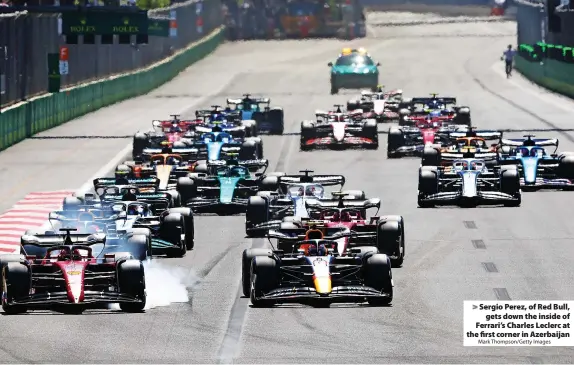  ?? Mark Thompson/Getty Images ?? Sergio Perez, of Red Bull, gets down the inside of Ferrari’s Charles Leclerc at the first corner in Azerbaijan