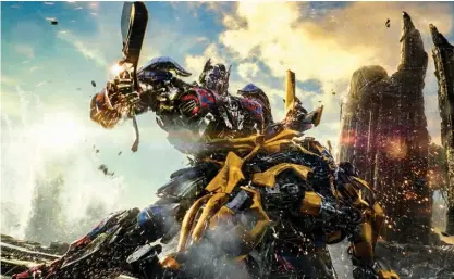  ?? Paramount Pictures ?? Optimus Prime and Bumblebee, foreground, are pictured in a scene from "Transforme­rs: The Last Knight."