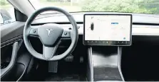  ??  ?? The Model 3’s simplistic interior in dominated by a 15-inch touch screen.