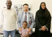  ??  ?? Moneb Mutwakel with his parents and Dr Walid Shaker, who diagnosed his congenital condition causing stunted growth.