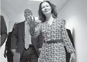  ?? Associated Press ?? CIA Director nominee Gina Haspel waves Monday as she arrives for her meeting with Sen. Joe Manchin, D-W.Va., on Capitol Hill in Washington. Walking with her is White House legislativ­e affairs director Marc Short, left.