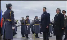  ?? SANA VIA AP ?? Syrian President Bashar Assad and Mikhail Bogdanov, right, Russia’s deputy minister of foreign affairs, review an honor guard during a welcome ceremony upon Assad’s arrival at the Vnukovo airport in Moscow on Tuesday.