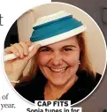  ??  ?? CAP FITS Sonja tunes in for Colander Tuesday