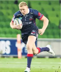  ??  ?? Rebel rising . . . Reece Hodge runs the ball up hard in a match against the Reds in Melbourne last year.