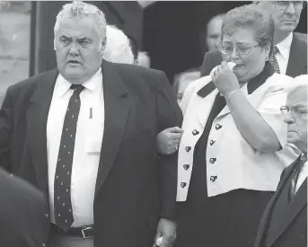  ?? FILES ?? Peter Dick, shown leaving his father’s funeral with his wife Eileen, was charged with first-degree murder in his father’s stabbing death, but died in July 2001 while out on bail awaiting trial.