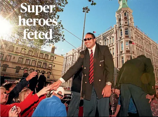  ??  ?? Norm Berryman greets the crowd at the Canterbury Crusaders’ Super 12 victory parade in Christchur­ch on June 3, 1998.