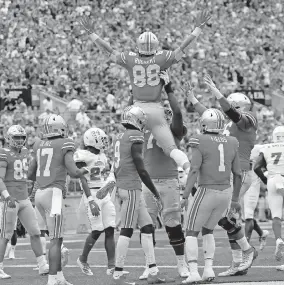  ?? [ADAM CAIRNS/DISPATCH] ?? Ohio State had a reason to celebrate after tight end Jeremy Ruckert (88) caught a 25-yard touchdown pass against Florida Atlantic on Aug. 31, 2019, and the Buckeyes received even better news when the Big Ten announced it would allow fall sports, including football, in 2020.