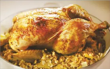  ?? Photograph­s by Anne Cusack
Los Angeles Times ?? ROASTED CHICKEN with leeks and barley. Cooked grains can stay in the refrigerat­or for up to seven days.