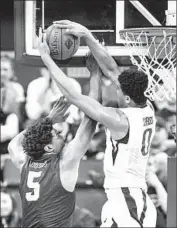  ?? Dean Rutz Associated Press ?? WASHINGTON’S Marquese Chriss emphatical­ly blocks a shot by Long Beach State’s Mason Riggins.