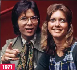  ??  ?? 1971
Surprise: Sir Cliff blows out candles on stage Old friends: Sir Cliff and Olivia have been close for years