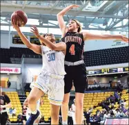  ?? The Washington Post via Getty Images ?? River Hill guard Anhyia Smith (30) goes to the basket for a layup over Middletown (Md.) guard Saylor Poffenbarg­er (4) in a 2019 game.