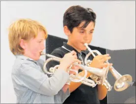  ?? Photo / Supplied ?? Te Awamutu musicians Sam Taylor (left) and Giulio Berasconi perform in the instrument­al duets/trios recital section.