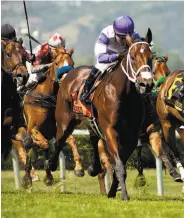  ?? Shane Micheli / Vassar Photograph­y ?? B Squared charges toward victory in the Silky Sullivan Stakes at Golden Gate Fields.