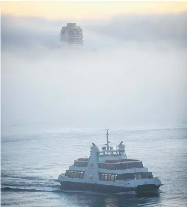  ?? Photo / Michael Craig ?? Thick fog yesterday led to dozens of flight cancellati­ons and delays.