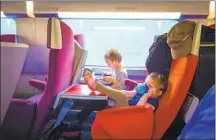  ?? Jekaterina Nikitina Getty Images ?? KIDS CAN STRETCH out and play more comfortabl­y on a train, and they can travel for half the adult fare on many routes.