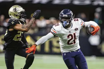  ?? BUTCH DILL / AP ?? Bears running back D’onta Foreman pushes past Saints cornerback Marshon Lattimore last season. Foreman, who has reached a deal to play for the Browns, gained 425 yards on 109 carries in nine games last season.