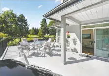  ??  ?? This five-bedroom Maple Ridge home, which features a large deck off the family room, sold for $1.15 million after just one day on the market.