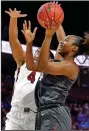  ?? (AP/Richard Shiro) ?? Arkansas’ Erynn Barnum (right) puts up a shot against South Carolina’s Aliyah Boston (4) during the No. 25 Razorbacks’ 90-64 loss to the top-ranked Gamecocks on Saturday in the semifinals of the SEC Women’s Tournament in Greenville, S.C.