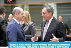  ??  ?? BRUSSELS: German Finance Minister Olaf Scholz (left) talks with President of the ECB, Mario Draghi (right), during an Eurogroup meeting at the EU headquarte­rs in Brussels. —AFP