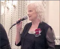  ??  ?? New inductee Nan Maureen Renaud sings.