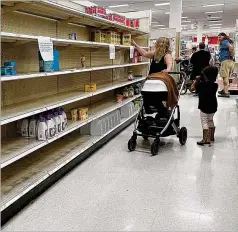  ?? JIM WATSON/AFP VIA GETTY IMAGES/TNS ?? Store shelves in many locations are empty of baby formula because of a nationwide shortage of supply, in part because of regulation­s that limited the number of manufactur­ers in the U.S.