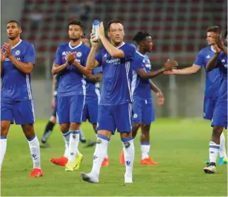  ?? – Credit ?? THANK YOU: Chelsea’s John Terry applauds fans at the end of the match..