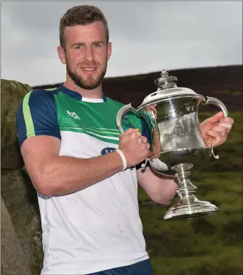  ??  ?? Tadhg Haran of Galway with Corn Setanta after winning the Senior Hurling event during the M Donnelly GAA All-Ireland Poc Fada Finals on Annaverna Mountain.