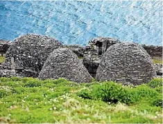  ??  ?? Beehive stone huts of the monastery on Skellig Michael.