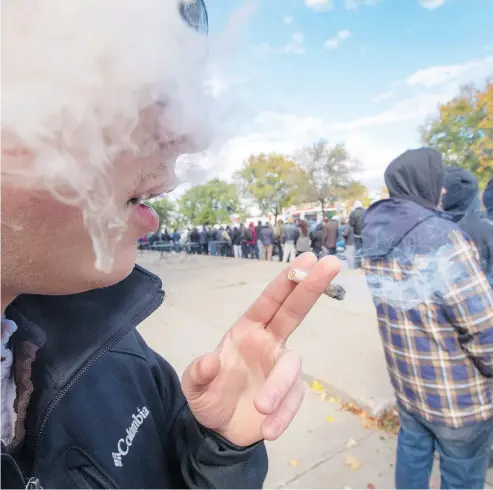  ?? RYAN REMIORZ / THE CANADIAN PRESS ?? The legal sale of cannabis began in many parts of Canada with long lineups, like this one in Montreal.