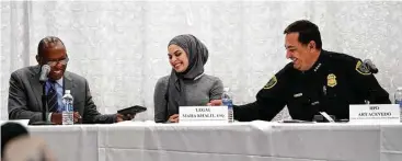  ?? Karen Warren / Houston Chronicle ?? Mayor Sylvester Turner, left, Maha Khalil, attorney at the Houston Immigratio­n Legal Collaborat­ive, and Police Chief Art Acevedo participat­e in a panel discussion during a town hall meeting Monday night.