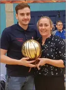  ??  ?? Killorglin coach Ignas Sijanus receiving his Coach of the Month award by Mary Gardiner from Basketball Ireland.