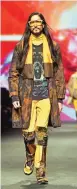  ??  ?? Models present creations for fashion house Etro during the Men's Fall-Winter 2017-2018 fashion week.