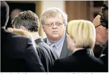  ?? JAY JANNER / AMERICAN-STATESMAN ?? State Sen. Paul Bettencour­t, R-Houston, who filed a bill reforming sanctions for improper teacher-student relationsh­ips, huddles Wednesday in the Senate chamber with his colleagues. The measure, SB 7, passed unanimousl­y.