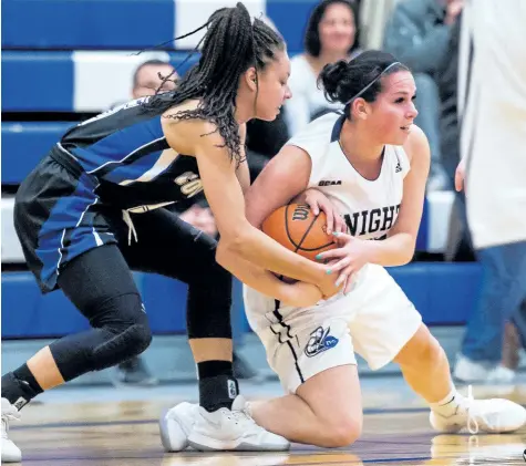  ?? RYAN MCCULLOUGH/ NIAGARA COLLEGE ?? A Sault defender, left, tries to strip the ball from Niagara's Mary Ingribelli in women's college basketball Saturday in Welland.