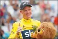  ?? Associated Press photo ?? Britain's Chris Froome, wearing the overall leader's yellow jersey, flashes a thumbs up on the podium after the twentieth stage of the Tour de France cycling race, an individual time trial over 22.5 kilometers (14 miles) with start and finish in...