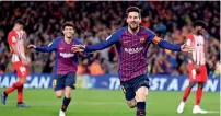  ?? AP ?? Lionel Messi celebrates his goal against Atletico during the La Liga match at the Camp Nou. —