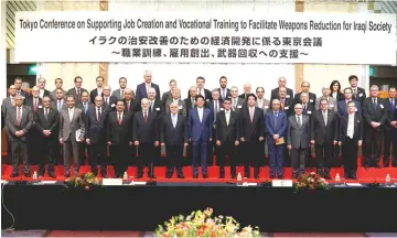  ??  ?? Iraqi Foreign Minister Ibrahim al-Jaafari (sixth left, front low), Iraqi Prime Minister Haider al-Abadi (seventh left, front low), Abe (eighth left, front low) and Japan’s Foreign Minister Taro Kono (ninth left, front low) attend a family photo session...