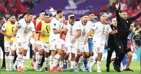  ?? ?? Atlas Lions of Morocco players and officials celebratin­g after the 2-1 win over Canada yesterday